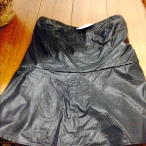 Sleeveless leather look peplum top