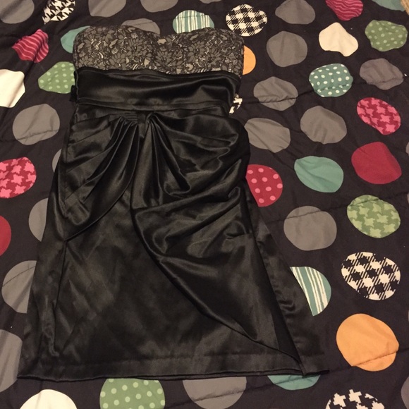 A lace flowery  gray top black dress.