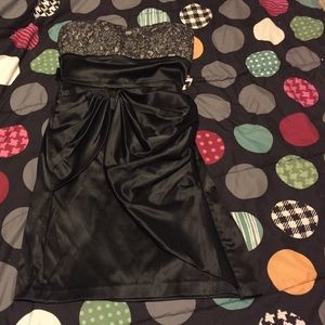 A lace flowery  gray top black dress.