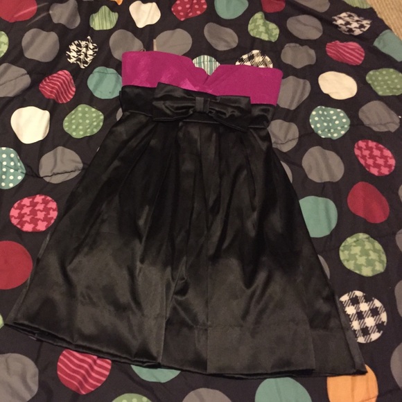 Strapless purple/pink top black dress.