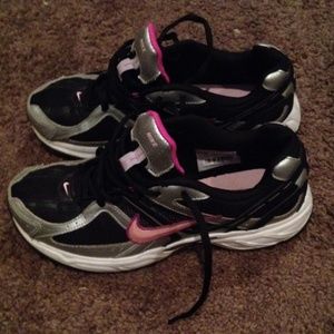 Pink and black nike run shoes