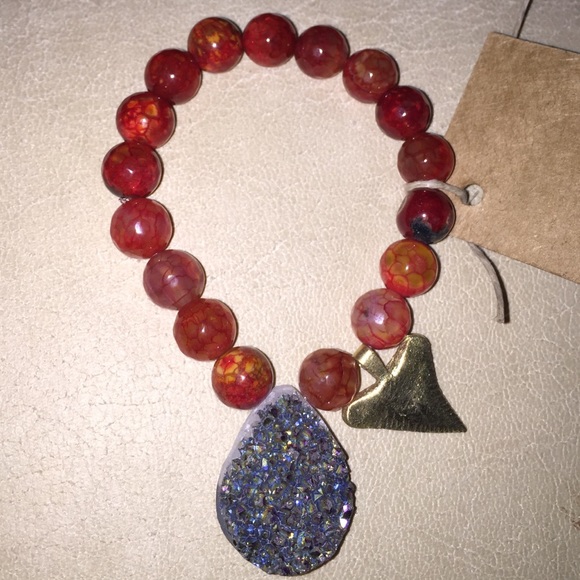 Red Polished stone bracelet with sharks tooth