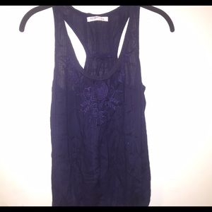 A regular tank top with designs across the top.