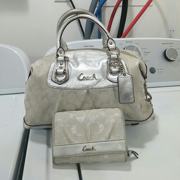 White and silver COACH purse with twofold wallet