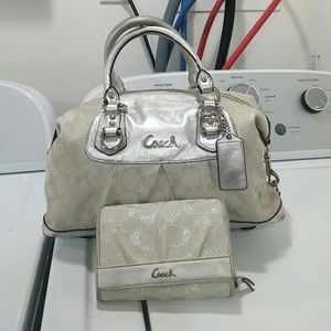 White and silver COACH purse with twofold wallet