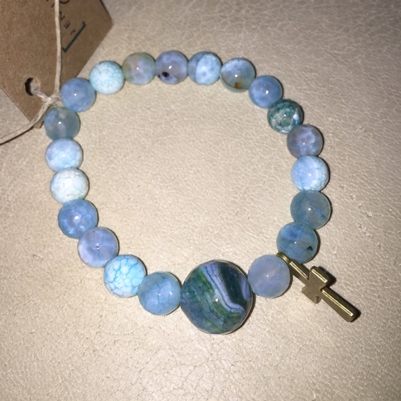 Blue polished stone bracelet with metal cross