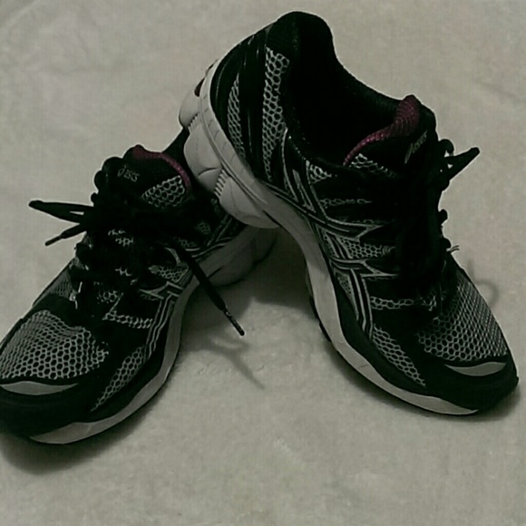 Pair of Asics tennis shoes
