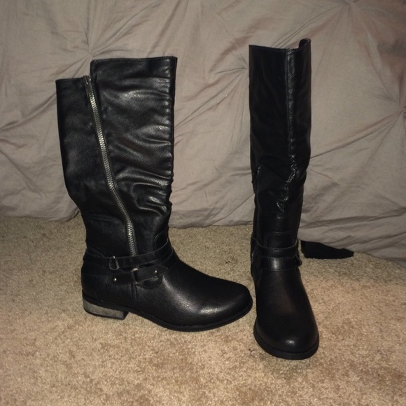 Black riding boots with zipper detailing