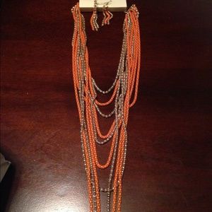 Orange and gold necklace with matching earrings