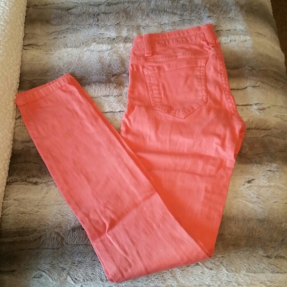 Coral skinny jeans.