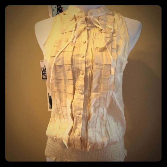 Cute top with buttons and shirred waist.  NWOT.