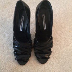 Manolo Blanik patent black pumps