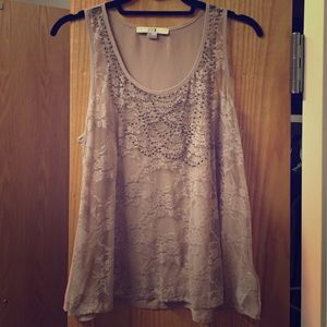 Champagne colored tank top with gem detail.