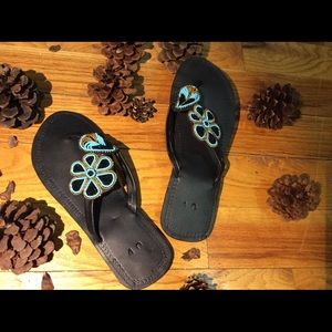 Safari sandals. Exquisitely beaded Maasai saddles!