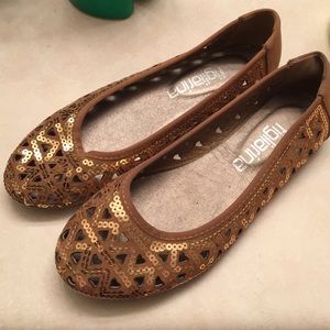 Brown flats with heart cutouts