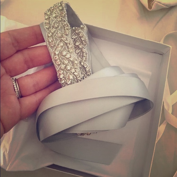 Two light silver wedding belts.