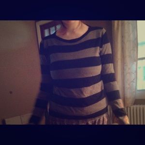 Stripped shirt ! Is a large fits like a medium.