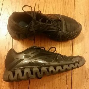 All black Reebok ZIGS sneakers