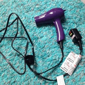 Travel sized blow dryer with attachments
