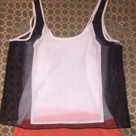 white, coral, and black shirt
