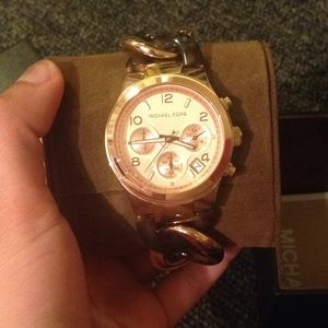 Michael Kors never worn. Still in box.