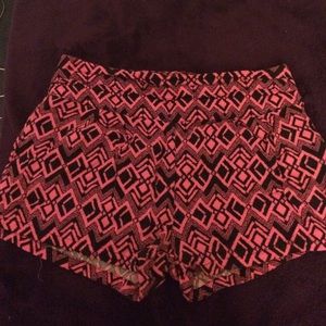 Pink and black shorts.