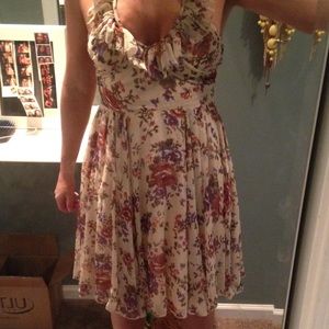 Floral dress in ivory with back detail.