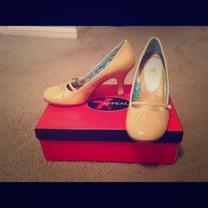 Tan Mary Jane style shoes