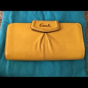 Mustard/ Yellow Coach wallet.