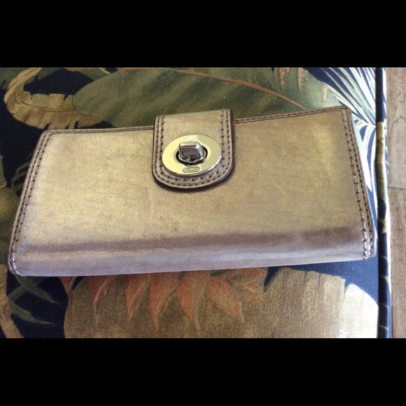 Sold........ gold metallic clutch wallet