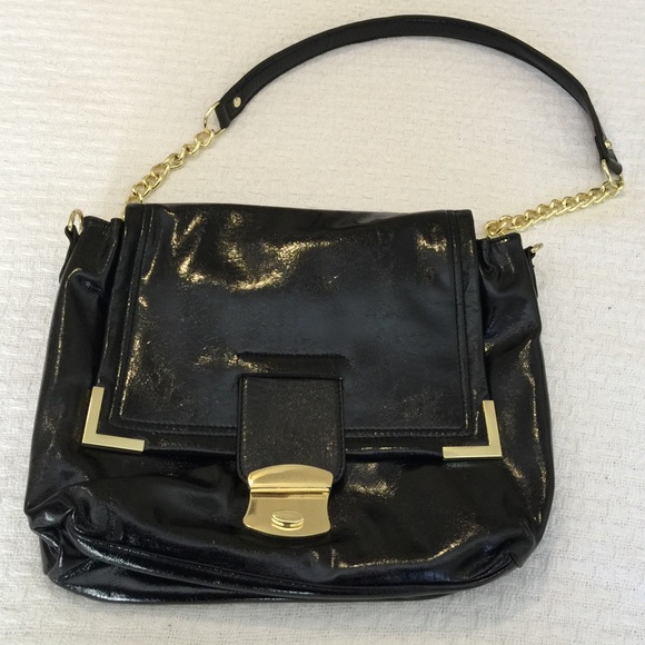 Black faux patent leather bag with gold accents.