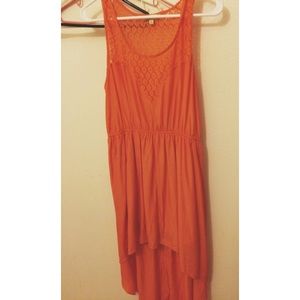 Orange, high low dress, sweat heart neck.