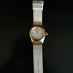 Gold face watch, white leather, couple scratches