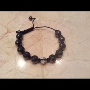 Bracelet with black beads and cristal bead