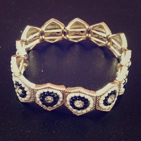Fashion bracelet in gold tone with rhinestones