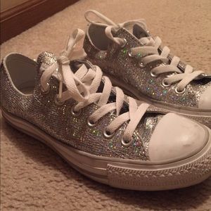 Silver glitter Converse All Star shoes.