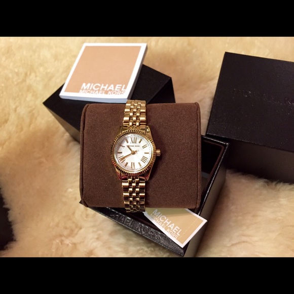 For sale. 💯% Authentic ladies gold MK watch.