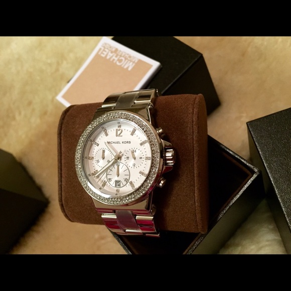 For sale. 💯% Authentic ladies silver MK watch