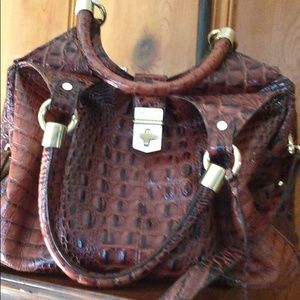 Melbourne pecan color purse. No cracks in leather