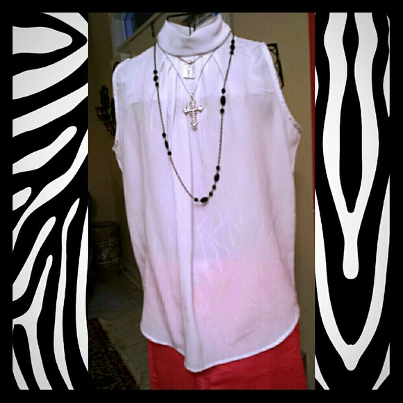 White sleeveless blouse.