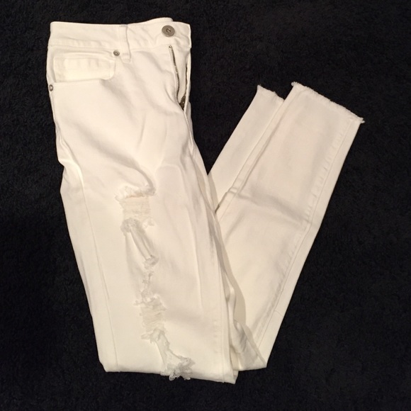 High waisted, white, ripped jeans. Size 5