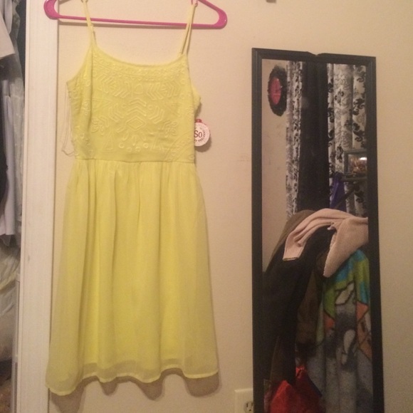Yellow spaghetti strap dress.
