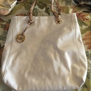 2 minor stains, none inside. Authentic MK. White.