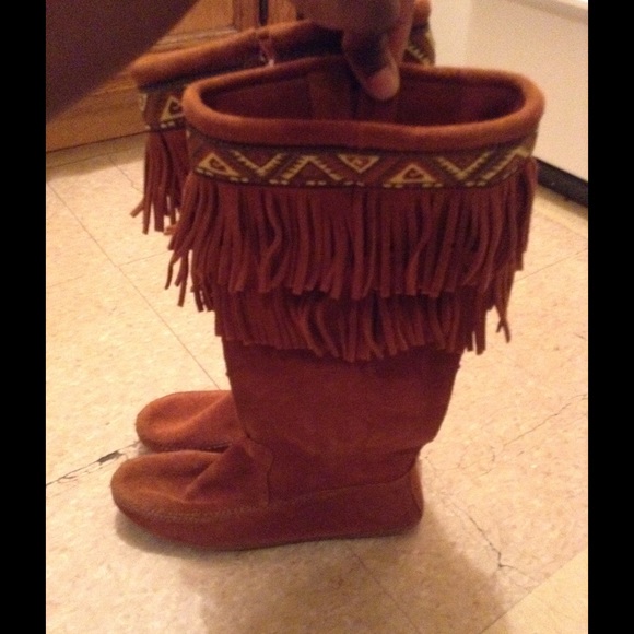 Minnetonka knee high double layer fringe boots.
