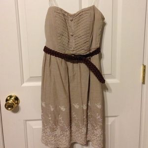 Light brown/tan strapless dress.