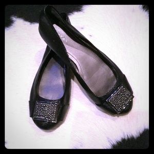 Calvin Klein.  Black leather flats.