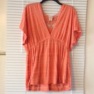 Coral empire-waist tee with lace detail on back