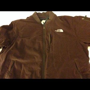 A  XL brown down jacket . Five zipper pocket.