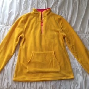 Yellow fleece shirt.