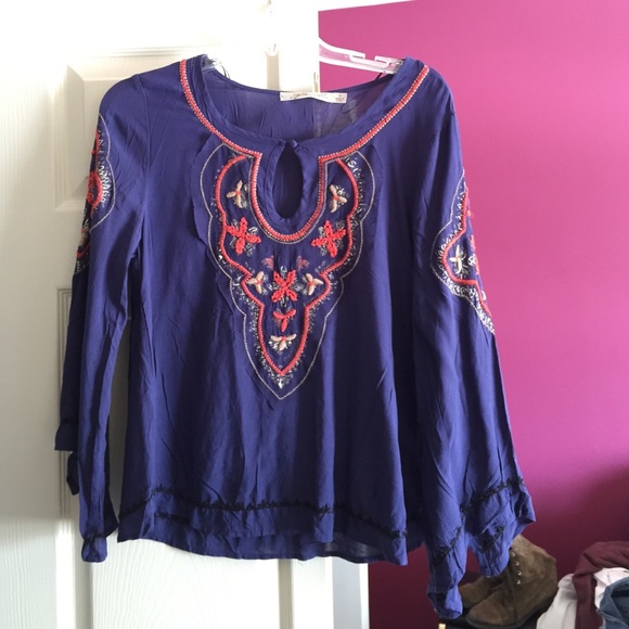 A beautiful flowy shirt, dark purple with decals!